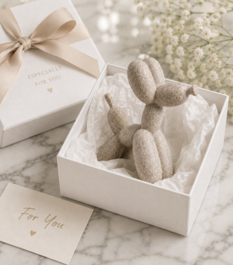 Sandstone balloon dog statue in white gift box with tissue paper and gift card