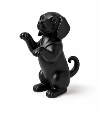 Black raised paw puppy figurine in begging pose — cute dog lover desk ornament